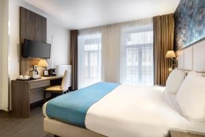Cama o camas de una habitación en Dansaert Hotel