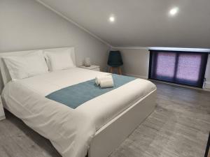 En eller flere senge i et værelse på Apartamentos do Lameirinho