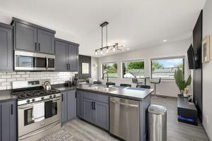 a kitchen with a sink and a stove top oven at North-east arts district loft in Minneapolis