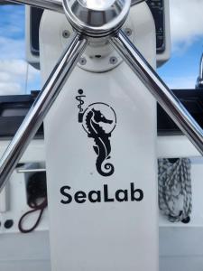 a sign on a boat with a seahawk on it at Spacious 52 ft Catamaran for Dockside Stay in Key West