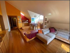 a living room with two couches and a table at Casa Maia in Baveno