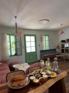a living room with a table with food on it at Matilda's house in Majdal Shams +9 photos