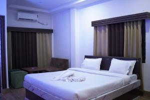 Gangotri Resort客房内的一张或多张床位