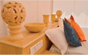 Un pat sau paturi într-o cameră la The Desert Gateway Resort