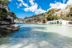 a river with a rock in the water at Villa Gloria in Cala Pi