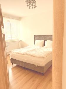 Posteľ alebo postele v izbe v ubytovaní Trio Apartments