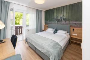 Postel nebo postele na pokoji v ubytování Hotel Garni Wurzer