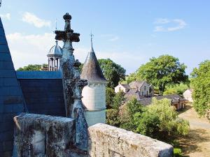 an old building with a cross on top of it at Chateau de Coubloust in Vicq-sur-Nahon