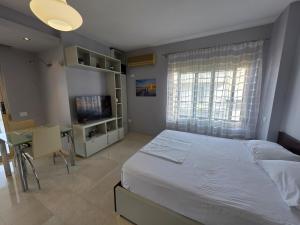 A bed or beds in a room at Bes Sea View Studio