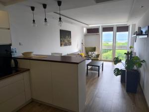 a kitchen with a island in the middle of a room at Downtown Apartment in Warsaw