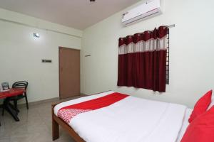 Postel nebo postele na pokoji v ubytování Super Hotel O Nandi Inn