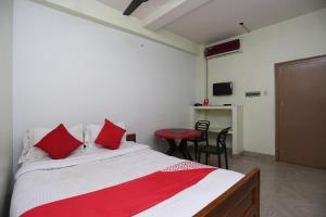 Postel nebo postele na pokoji v ubytování Super Hotel O Nandi Inn
