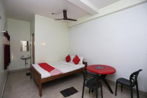 Postel nebo postele na pokoji v ubytování Super Hotel O Nandi Inn