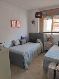 Posteľ alebo postele v izbe v ubytovaní Buenavista Home Moncofar