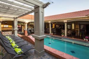 The swimming pool at or close to The Royal Palm B&B