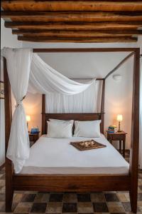 Кровать или кровати в номере Archipelago Sifnos - Seaside Accommodation