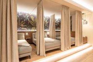 Postelja oz. postelje v sobi nastanitve Boutique Hotel Aichinger