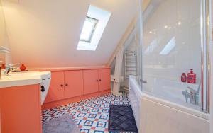 a bathroom with a sink and a bath tub at Les lys in Saint-Julien-les-Villas +19 photos