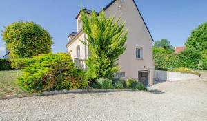a house with a tree in front of it at Les lys in Saint-Julien-les-Villas