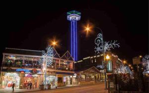 a tower lit up at night with christmas lights at Urban Cowboy Holiday home in Gatlinburg