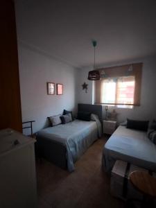 Posteľ alebo postele v izbe v ubytovaní Buenavista Home Moncofar