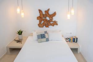 Кровать или кровати в номере Archipelago Sifnos - Seaside Accommodation