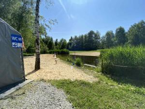 a person playing a game of frisbee in a yard at Zaskawie Apart in Wadowice +4 photos