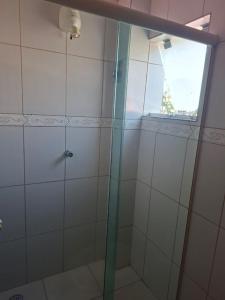 a shower with a glass door in a bathroom at papillon hotel in Sao Paulo +7 photos