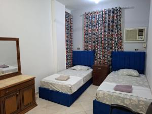Un pat sau paturi într-o cameră la david hostel