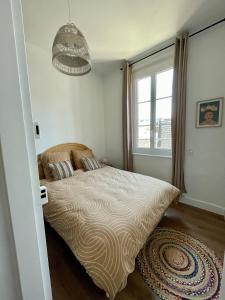 Ένα ή περισσότερα κρεβάτια σε δωμάτιο στο Appartement t2 cosy hypercentre 3mn de la plage