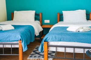 Giường trong phòng chung tại Hotel Mountime Kazbegi