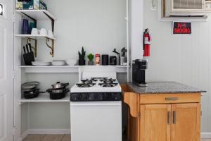 a kitchen with a stove and a counter top at Cozy 1st Floor apt blocks from Beach Boardwalk 2 in Wildwood +6 photos