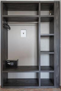 a wooden book shelf with a radio on it at Urban Hotel in Cesena +44 photos