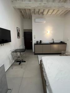 TV a/nebo společenská místnost v ubytování Studio d'Art - Centro Storico di Arezzo