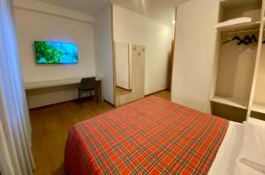Postel nebo postele na pokoji v ubytování Hotel International