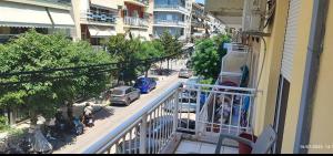 a balcony of a building with a view of a street at Alexandroupolis Lighthouse Apartment P!!! in Alexandroupoli