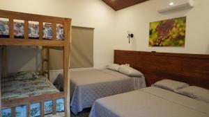 Postel nebo postele na pokoji v ubytování Apino Lodge del Celaque