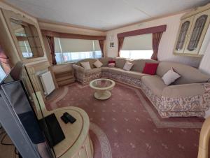 an aerial view of a living room with a couch at 21 Chestnut Grove in Kirkcolm