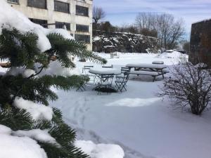 a picnic table in a yard covered in snow at Coté Tiretaine in Orcines