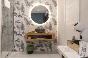 a bathroom with a sink and a mirror on a wall at B&B PierGaia in Santa Maria di Castellabate +35 photos