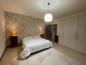 A bed or beds in a room at Hotel Clementi