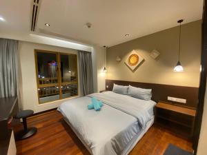 Postel nebo postele na pokoji v ubytování Sunway Resort Suite direct access to Mall & Lagoon + 25 fotografií