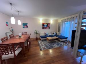 a living room with a table and a couch at Noa & Dan in Koper