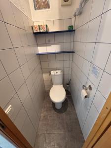 a small bathroom with a toilet in a stall at gite du mouredon in Vallon-Pont-dʼArc