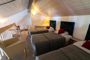 Posezení v ubytování Logis Hotel Arc En Ciel
