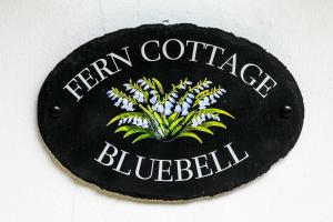 a sign that says iron cottages bluebell at Siston Stables by StayStaycations in Bristol
