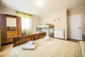 a bedroom with a bed with two towels on it at Nonna Arde in Beverino