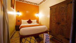 Postel nebo postele na pokoji v ubytování Riad Touhfa Kasbah Marrakech