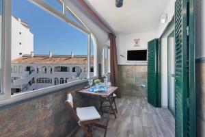 TV a/nebo společenská místnost v ubytování El Portil Apartamento