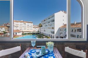 Bazén v ubytování El Portil Apartamento nebo v jeho okolí